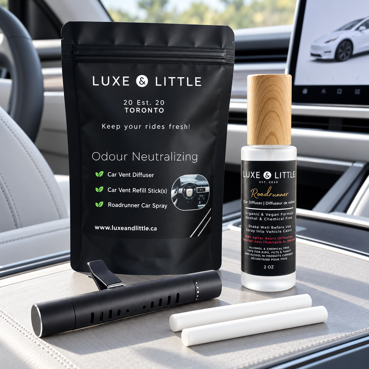 Roadrunner Car Set with pouch, spray, vent diffuser and refill sticks in a light-coloured electric vehicle interior