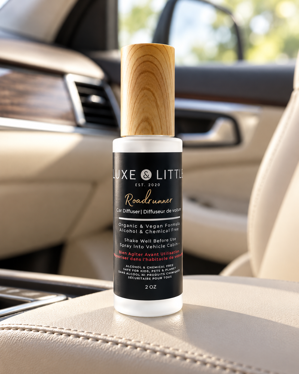Luxe and Little Roadrunner car spray with wooden cap in a beige leather car interior