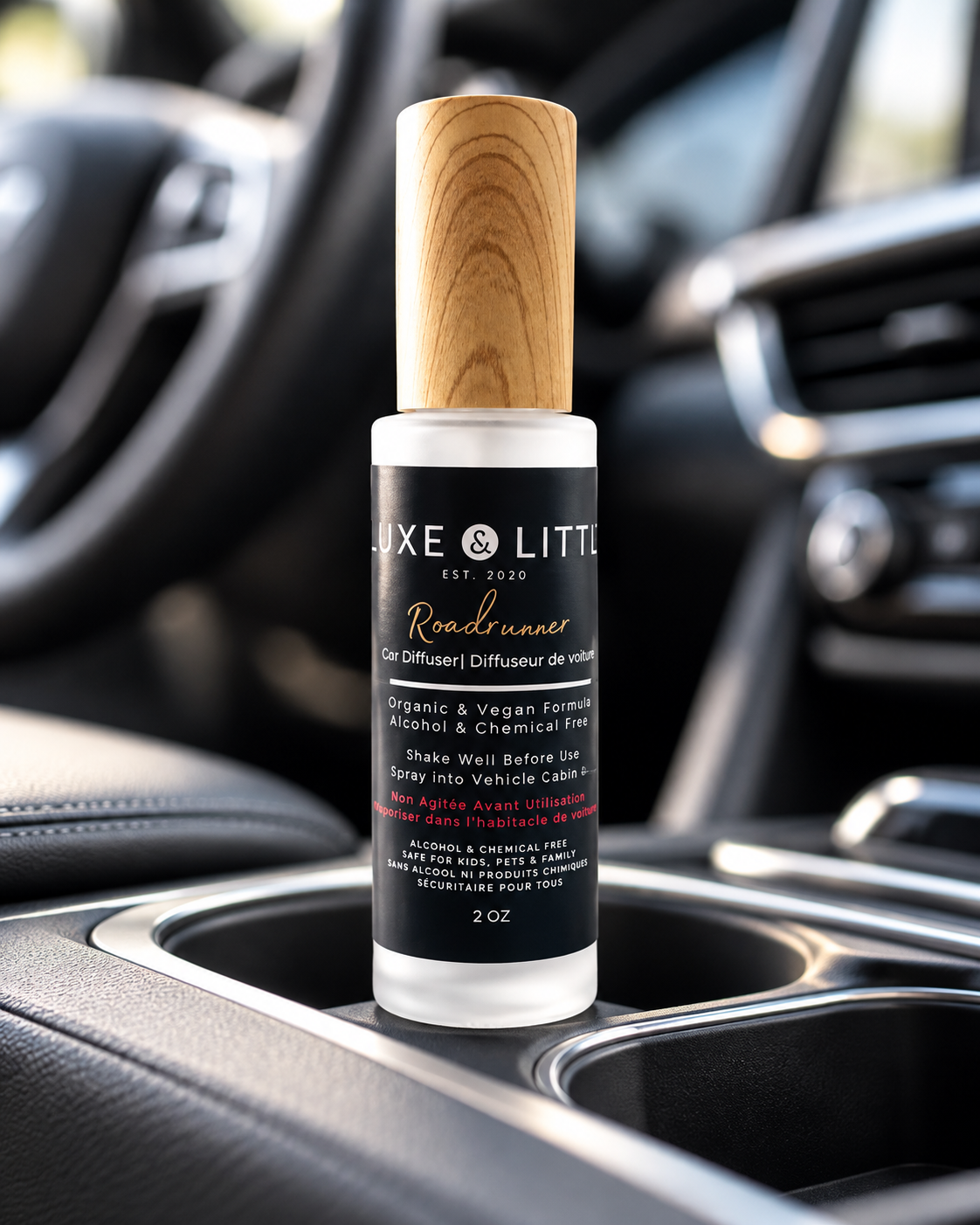Luxe and Little Roadrunner car spray bottle in a black vehicle centre console
