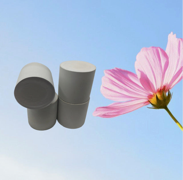 Handcrafted concrete candle vessels in natural finish